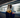 Person using phone while waiting for train